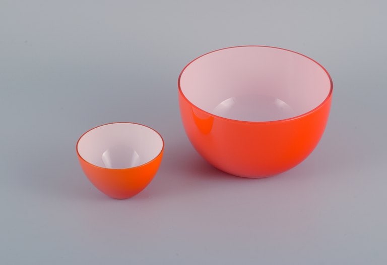 Piet Hein for Holmegaard. Danish design. Two orange art glass bowls.: Title: Piet Hein for Holmegaard. Danish design. Two orange art glass bowls. Description: Piet Hein for Holmegaard. Danish design. Two orange art glass bowls. Late 1900s. In perfect condition. Sticker.