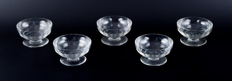 Baccarat, France, a set of five "Charmes" Art Deco champagne coupes in clear crystal glass. Faceted (1 of 5)