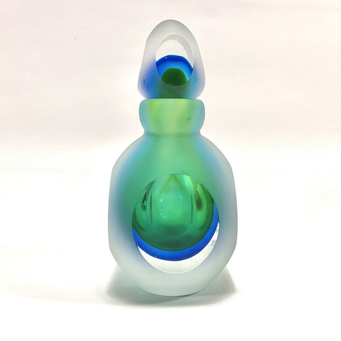 Glass Art Perfume Bottle - Peacock Colors: Title: Glass Art Perfume Bottle - Peacock Colors Maker/Brand: Unknown Origin: Unknown Date/Period: 1900s Materials: Glass Size:7" with topper Description: Peacock color scheme with matte and glossy fi