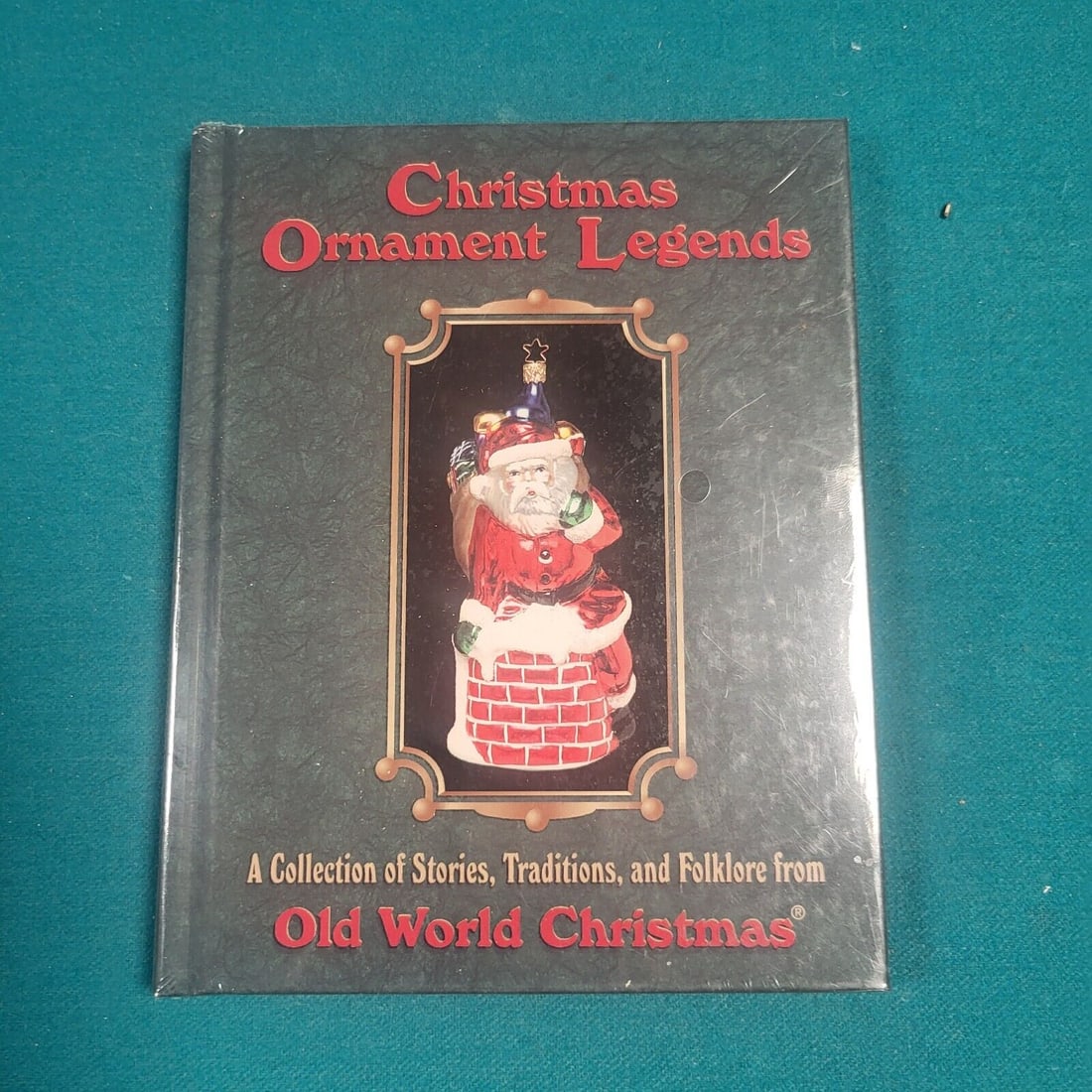 Christmas Ornament Legends: Old World Christmas - NIP Unopened: This Christmas Ornament Legends Vol. 1: The Genuine Collection of Stories, Traditions, and Folklore from the Old World published by Old World Christmas is a first edition hardcover book. It contains 8