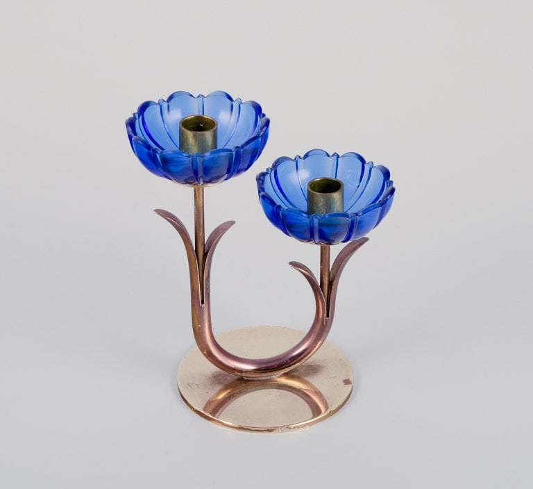 Gunnar Ander for Ystad Metall, Sweden. A pair of two-armed candle holders in brass and blue art: Title: Gunnar Ander for Ystad Metall, Sweden. A pair of two-armed candle holders in brass and blue art glass shaped like flowers. Description: Gunnar Ander for Ystad Metall, Sweden. A pair of two-arme