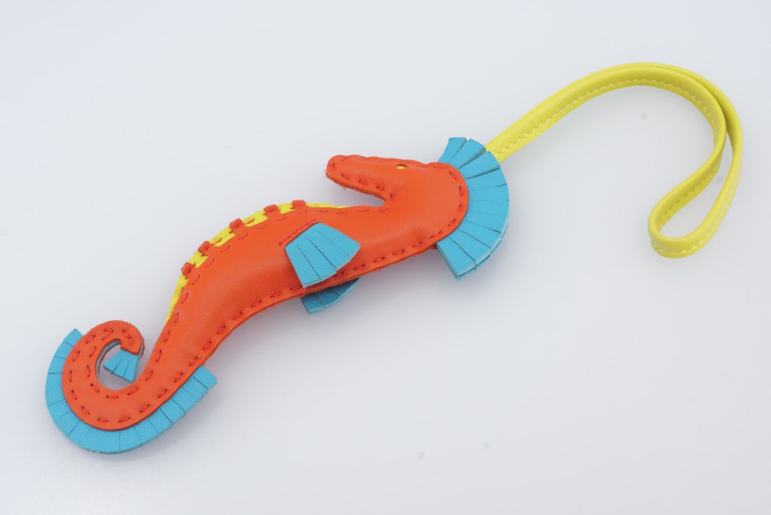Hermes Bag Charm - Sea Horse Charm 3 (orange/blue/yellow) - New: Title: Hermes Bag Charm - Sea Horse Charm 3 (orange/blue/yellow) - New Materials: Leather Description: Specifications Brand: HermÃ¨sÂ® Object: Bag Charm Model: Milo Lambskin Seahorse Bag Charm Yea