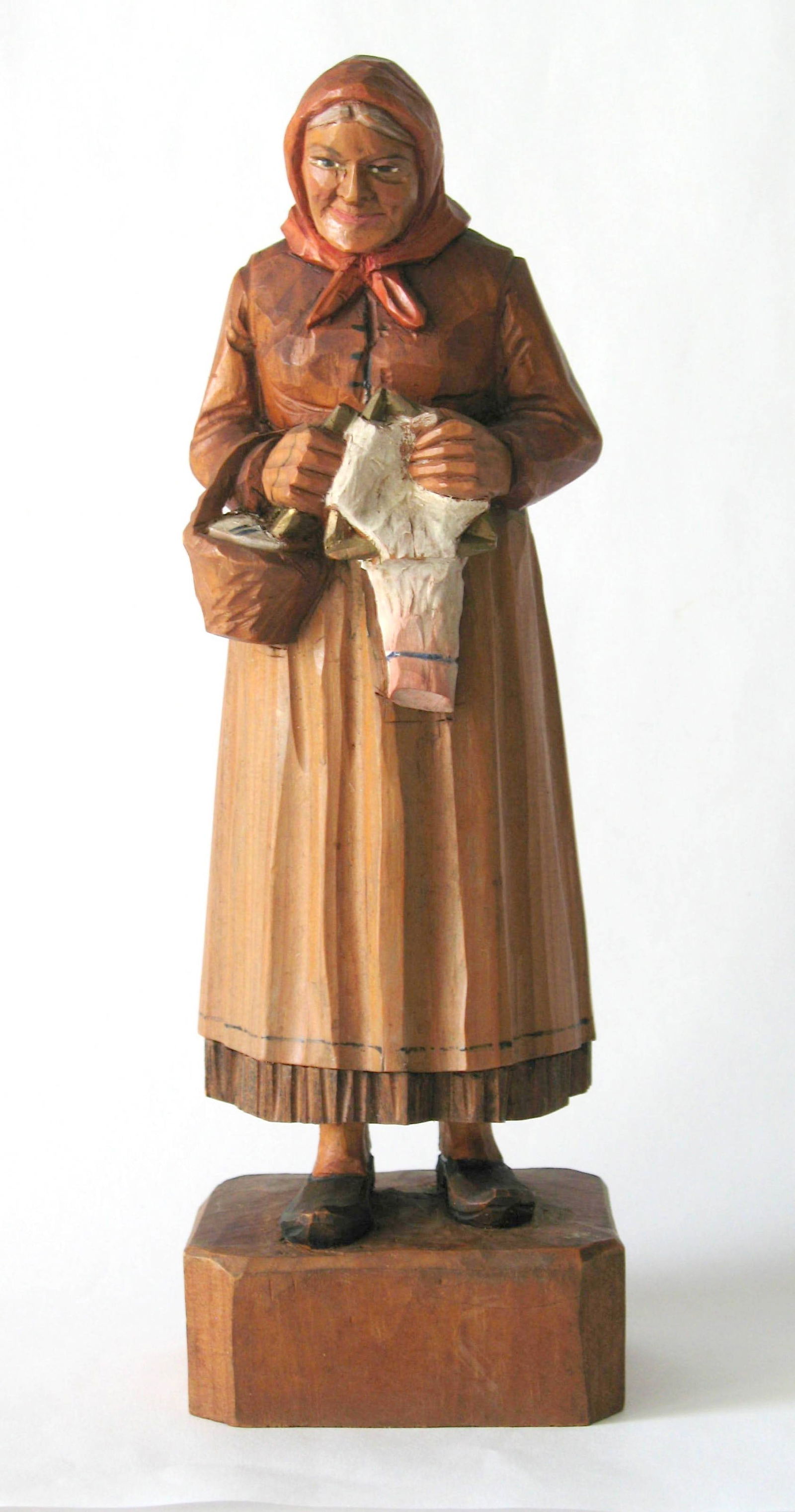 Antique folk art wood carving of an old woman (1 of 4)