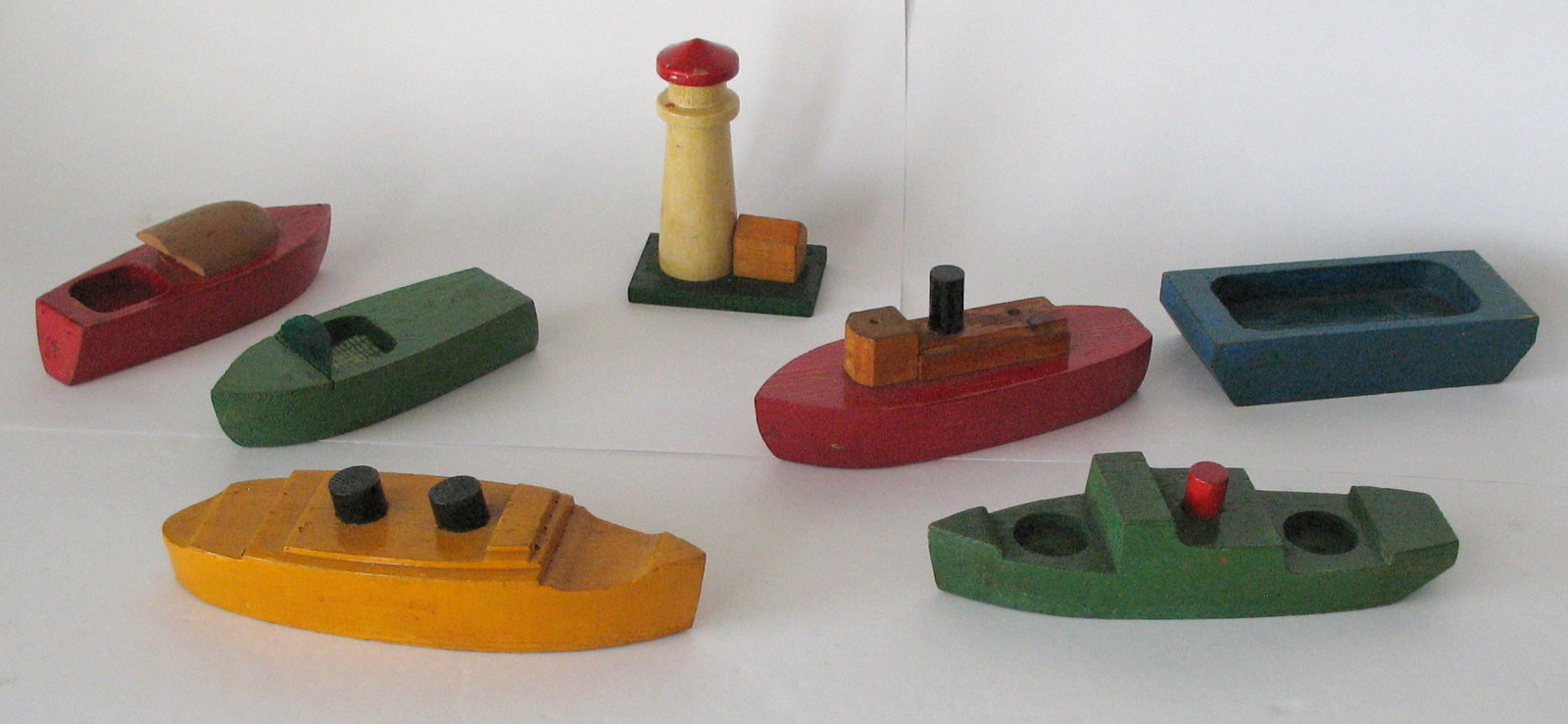 Group of vintage toy wood boats and lighthouse. (1 of 6)