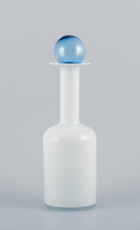 Otto Brauer for Holmegaard. Vase/bottle in white mouth-blown art glass with a light blue sphere.: Otto Brauer for Holmegaard. Vase/bottle in white mouth-blown art glass with a light blue sphere. 1960s. Remnants of a label. In perfect condition. Dimensions: Height 30.5 cm (with sphere) x Width 8.5