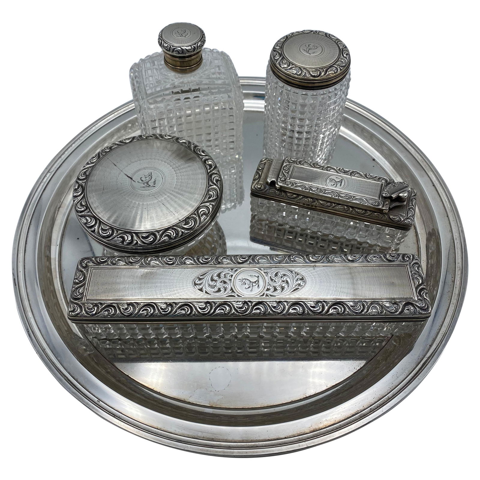 Art Deco Tiffany & Co Sterling Silver and Crystal Vanity Set: The set includes Tiffany & Co sterling serving tray, it is stamped with serial number 21253, q-tips jar, cotton balls jar, pill box, perfume bottle and tooth brush box. It is made out of etching sterl