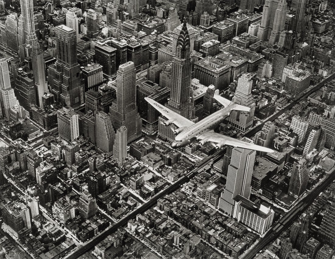 MARGARET BOURKE-WHITE - DC-4 in Flight Over Manhattan: Artist: Margaret Bourke-White Title: DC-4 in Flight Over Manhattan, 1939 Medium: Photo Litho, 2006, Italy Dimensions: 9.6x7.4" Description: Unmounted Artist Bio: Margaret Bourke-White (1904-1971) was