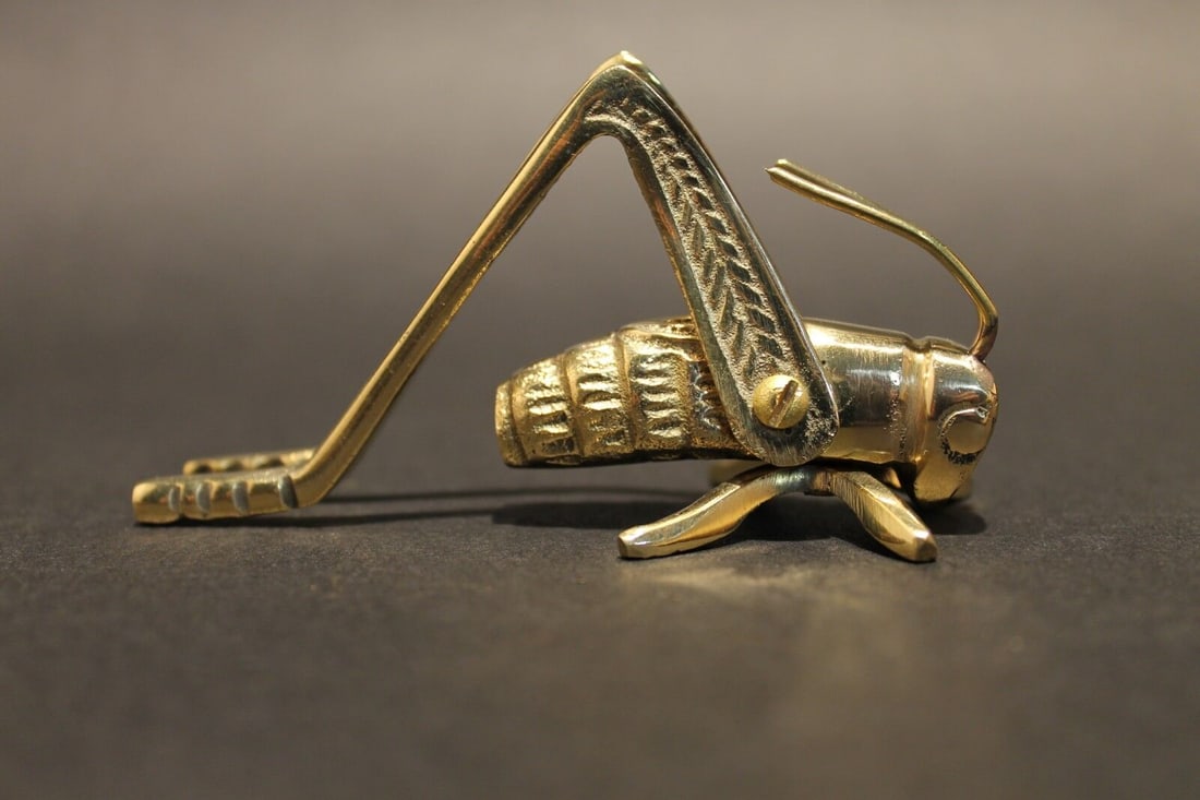 Good Luck Solid Brass Fireplace Hearth Cricket: 3 1/2" Long 1 1/8" Wide 2" Hide Wonderful antique style brass hearth cricket. Many times found on the hearth crickets are said to bring good luck and fortune to ones house and home. Nice detail and qu