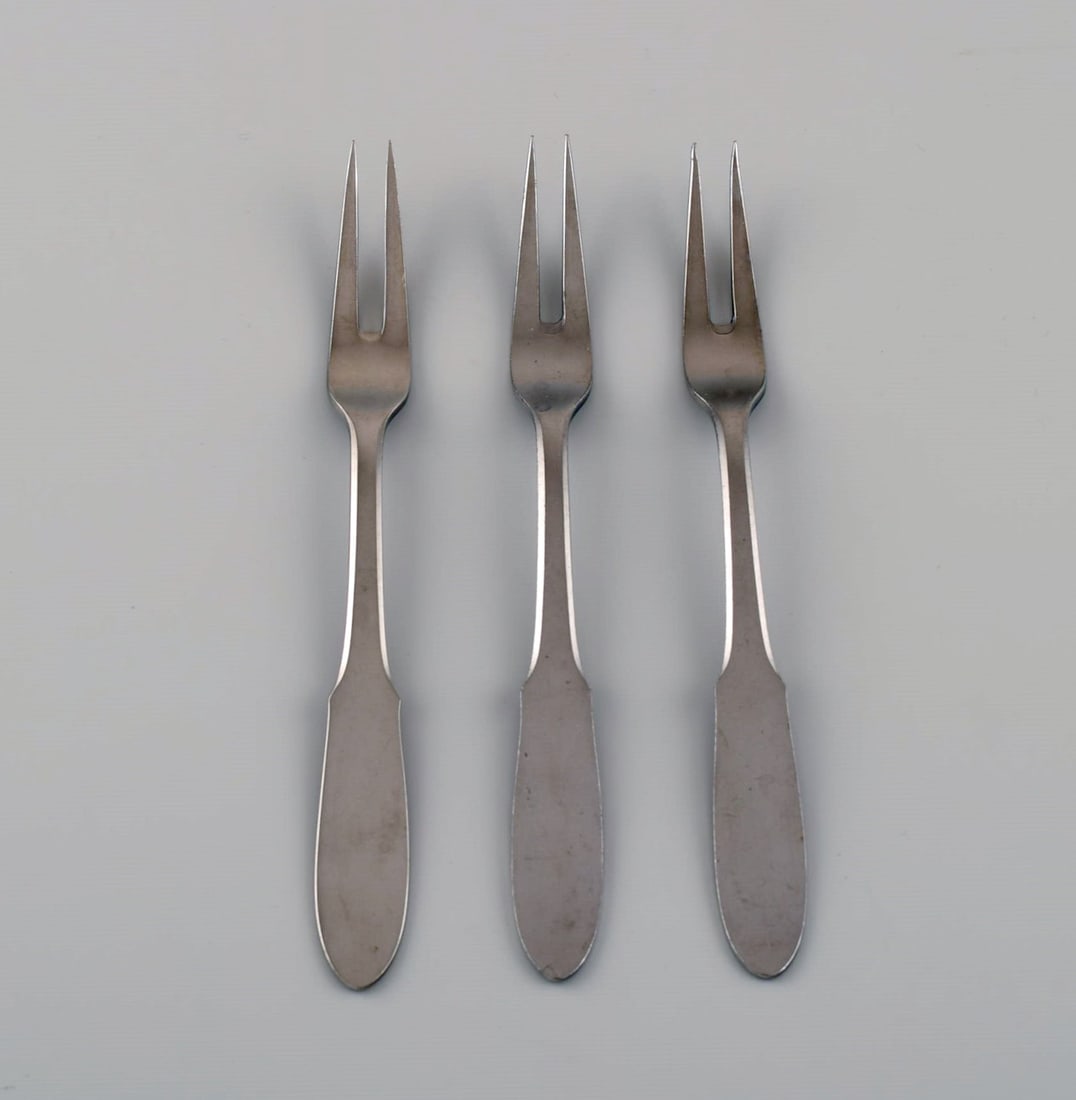 Gundorph Albertus for Georg Jensen. Three Mitra cold meat forks in stainless steel. 1970s.: Title: Gundorph Albertus for Georg Jensen. Three Mitra cold meat forks in stainless steel. 1970s. Description: Gundorph Albertus for Georg Jensen. Three Mitra cold meat forks in stainless steel. 1970s