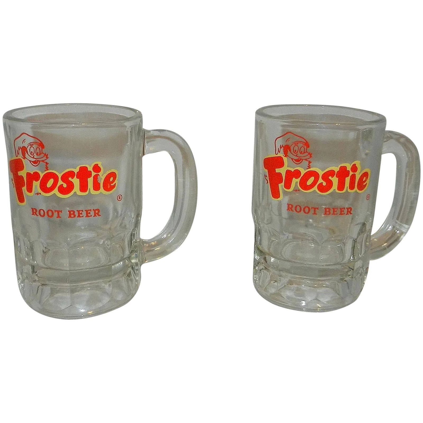 Vintage 1960s Frostie Root Beer Glass Soda Mugs by Hazel Atlas: These Vintage 1960s Frostie Root Beer Glass Soda Mugs by Hazel Atlas are heavy Advertising Collectibles in very good condition. They have a few scratches, and one logo has a small dab of paint missing