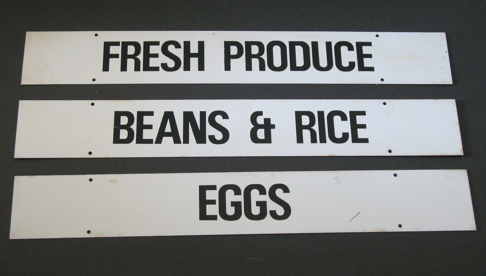 Group of vintage country store tin signs. (1 of 1)