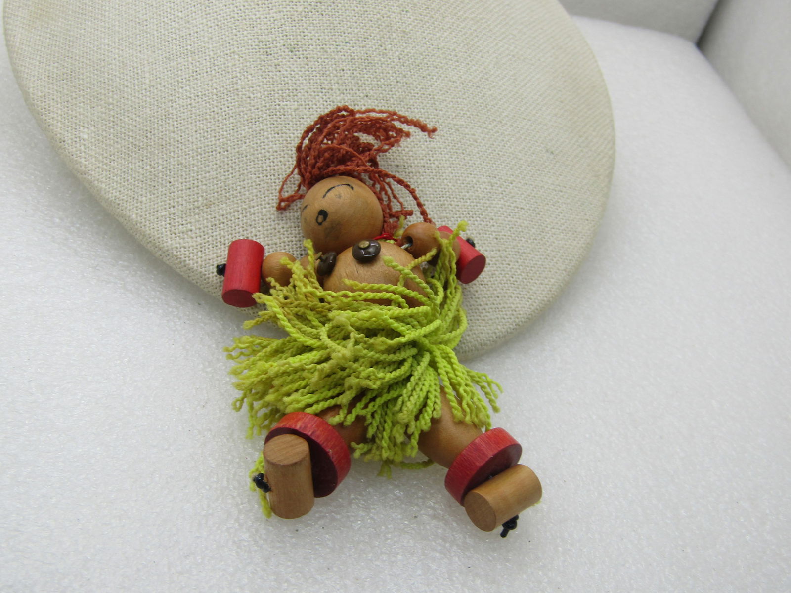 Vintage Wooden Island Hula Girl Doll Brooch, Hand Made: Vintage Wooden Island Girl Doll Brooch, Hand Made, Primitive design made from different shapes of round and barrel and disc beads in natural, lightly varnished and dyed. Brown yarn for hair and green