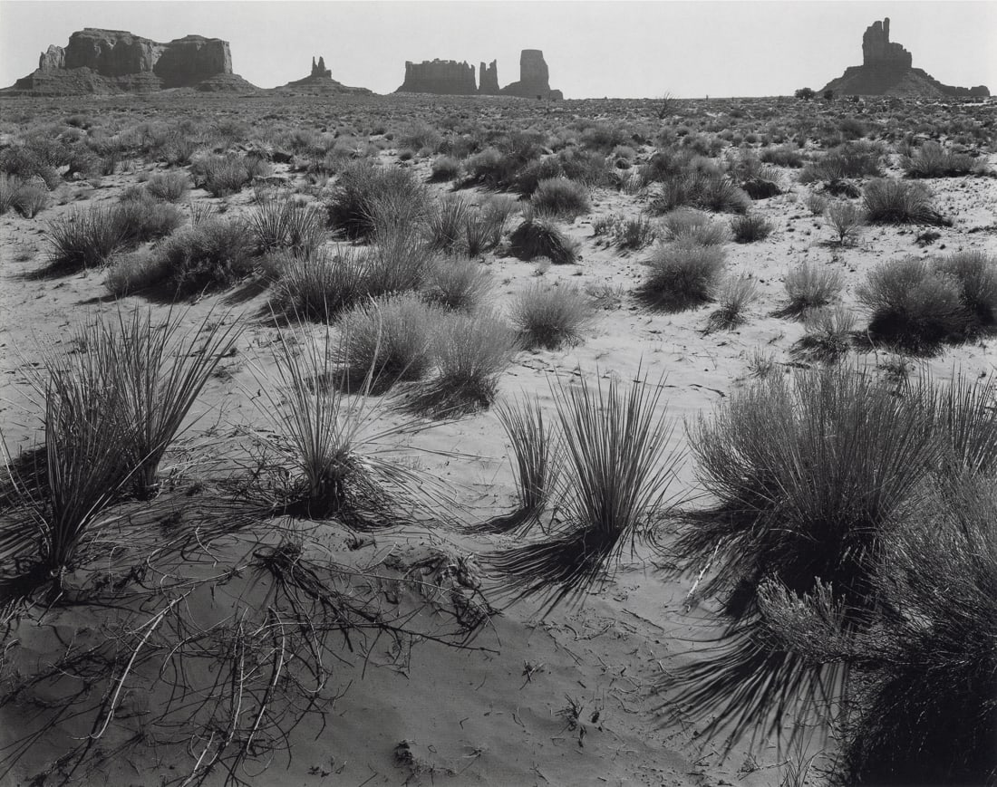 ANSEL ADAMS - Monument Valley, Arizona, 1958: Artist: Ansel Adams Title: Monument Valley, Arizona, 1958 Medium: Duotone Photo Litho, 1990, USA Dimensions: 10.25x8.1" Description: Heat Wax Mounted on 11x14" Conservation Board Artist Bio: Ansel Ada