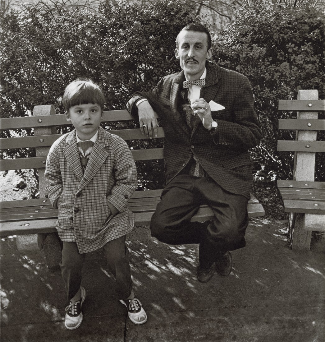 DIANE ARBUS - Man and Boy on a Bench in Central Park: Artist: Diane Arbus Title: Man and a Boy on a Bench in Central Park, NYC, 1962 Medium: Photo Litho, 1972, USA Dimensions: 8.3x8.72" Description: Heat Wax Mounted on 11x14" Conservation Board Artist Bi