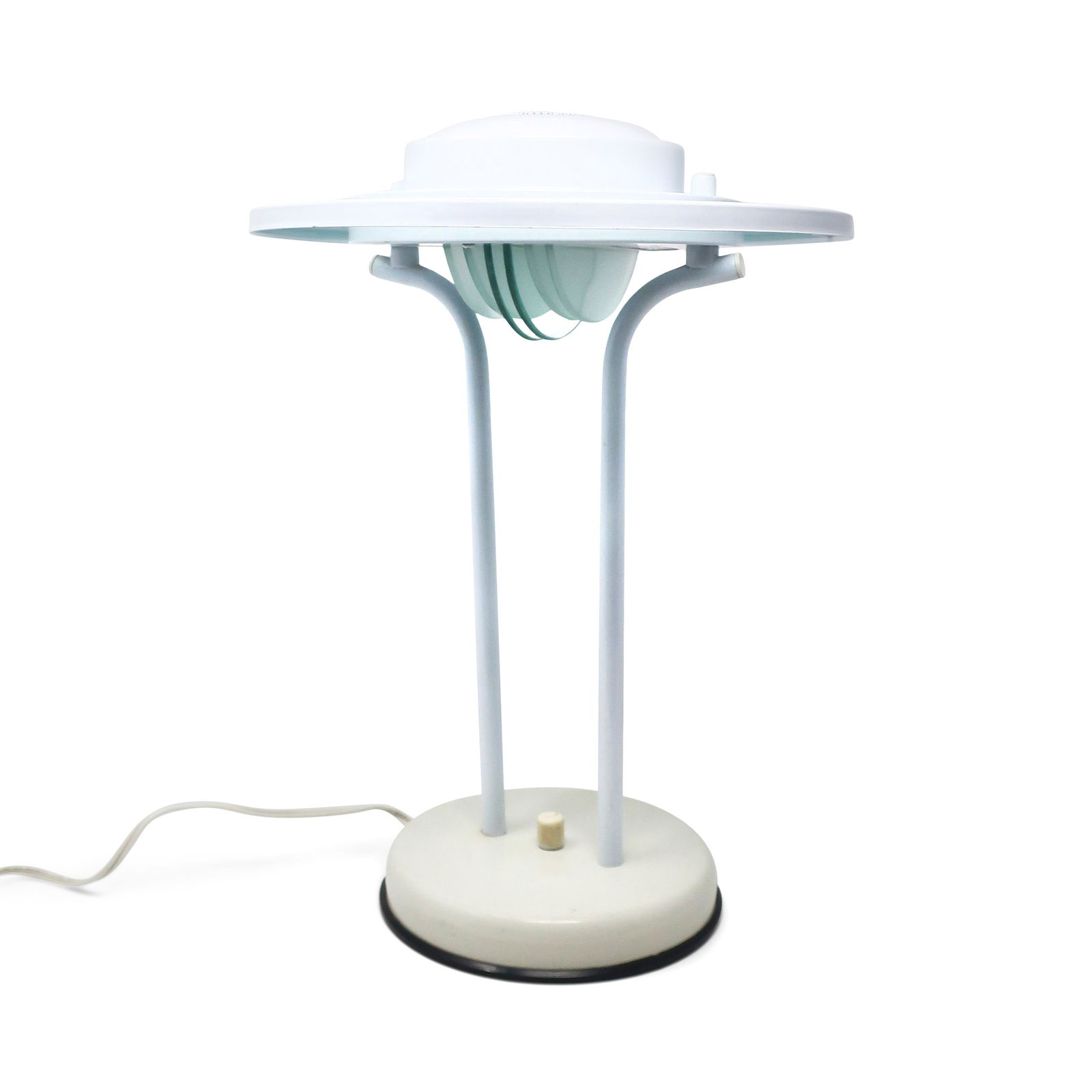 1980s Postmodern White Table Lamp by Nadair: A lovely postmodern flying saucer table lamp by Nadair, a Canadian lighting company, in the style of Robert Sonneman and George Kovacs. White enamled metal base, upright supports, and shade, half circ