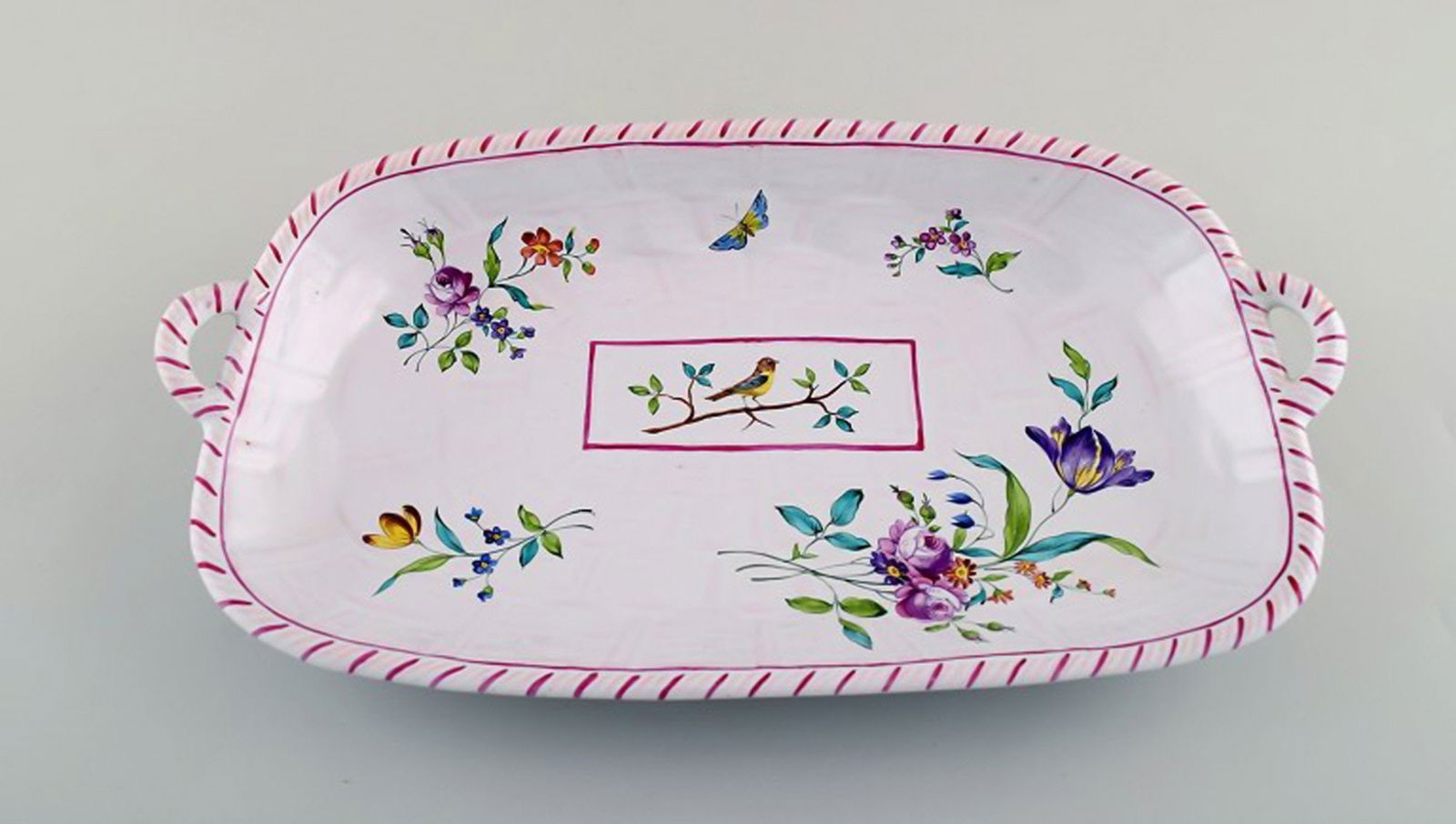 Emile Gallé for St. Clement, Nancy. Dish on four feet in hand-painted faience. Decorated with: Title: Emile Gallé for St. Clement, Nancy. Dish on four feet in hand-painted faience. Decorated with flowers and birds. 1870's. Description: Emile Gallé for St. Clement, Nancy. Dish on four