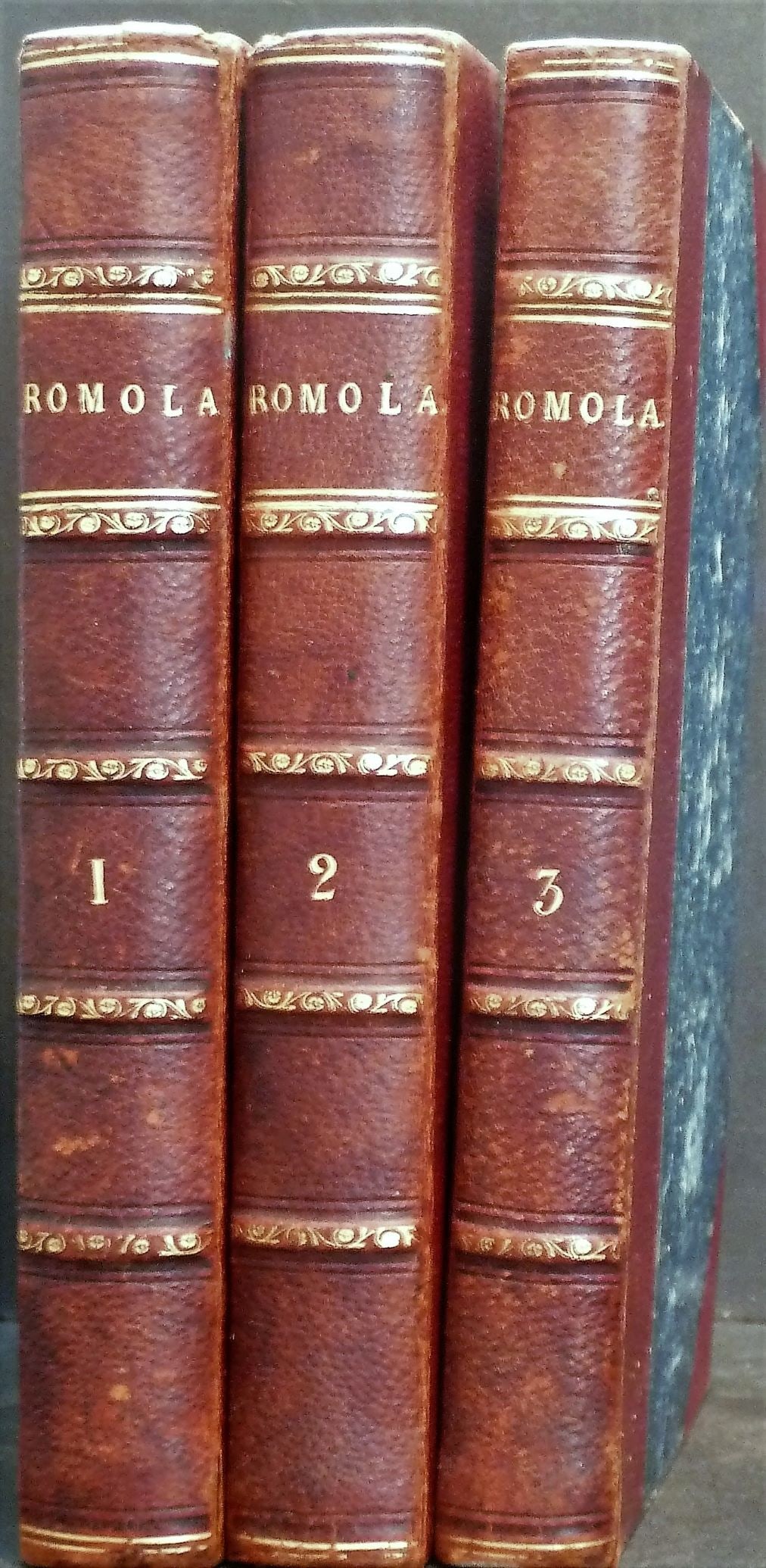 George Eliot - 'Romola' - Three Volumes, Half Leather Binding - 1863: Title: George Eliot - 'Romola' - Three Volumes, Half Leather Binding - 1863 Author: George Eliot Date/Period: 1863 Publisher: Smith, Elder and Co. London Edition: N/A Additional Information: 1863, har
