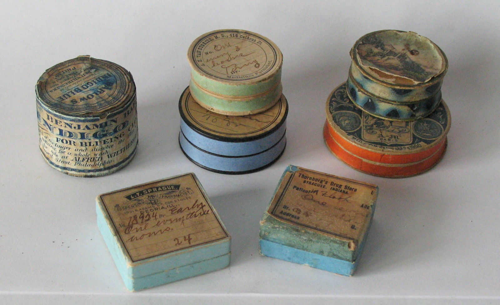 Group of early colorful pill boxes.: Title: Group of early colorful pill boxes. Date/Period: 1800's Dimension: largest is 2” diameter Additional Information: Nice group of early colorful cardboard pill boxes in great original patin