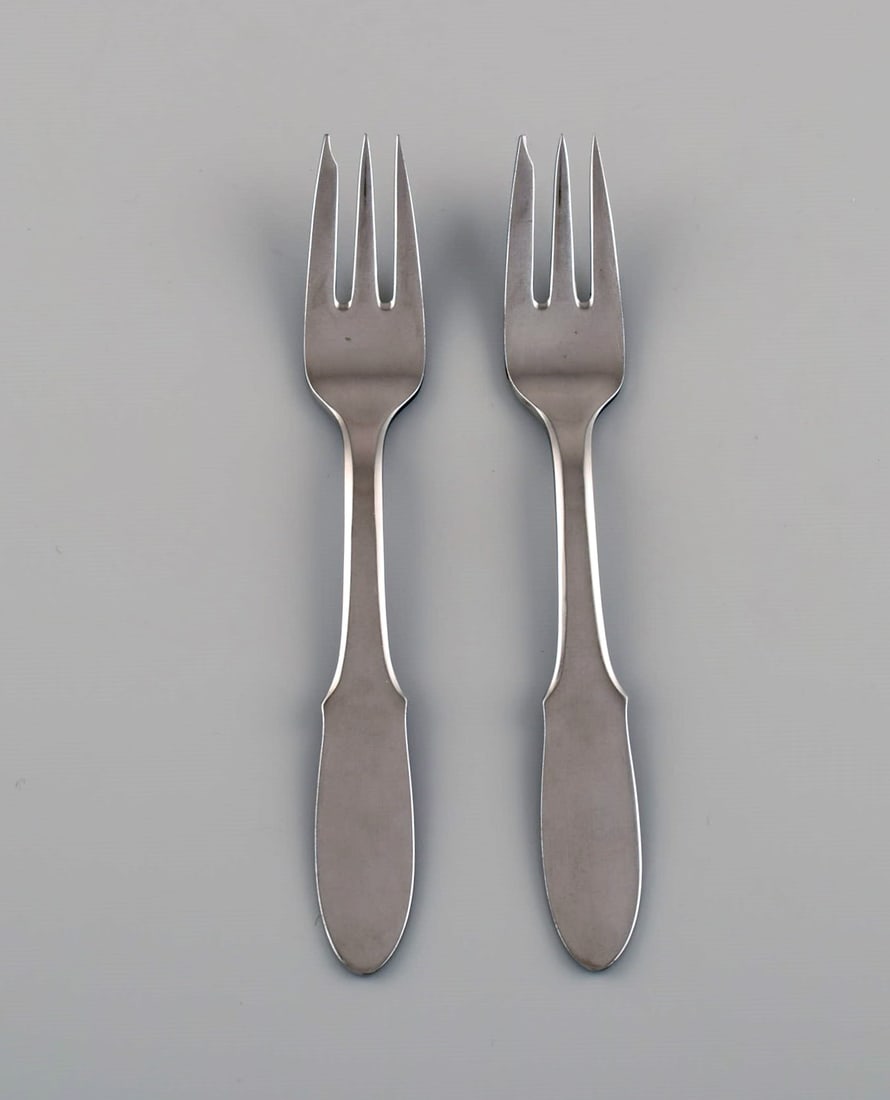 Gundorph Albertus for Georg Jensen. Two Mitra pastry forks in stainless steel. 1970s.: Title: Gundorph Albertus for Georg Jensen. Two Mitra pastry forks in stainless steel. 1970s. Description: Gundorph Albertus for Georg Jensen. Two Mitra pastry forks in stainless steel. 1970s. Length: