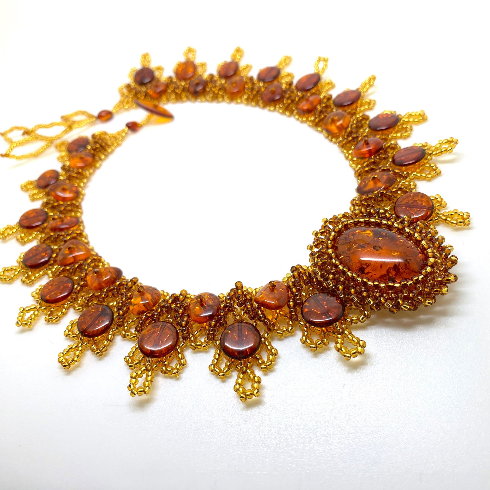 Outstanding Unique Vintage Amber Floral Necklace made from leaf like bead ornaments: Title: Outstanding Unique Vintage Amber Floral Necklace made from leaf like bead ornaments Metal: None Gemstones:Amber Weights:49.52 g Size:Size: 450.0 x 40.0 x 10.0 mm Size: 17.717 x 1.575 x 0.394 in
