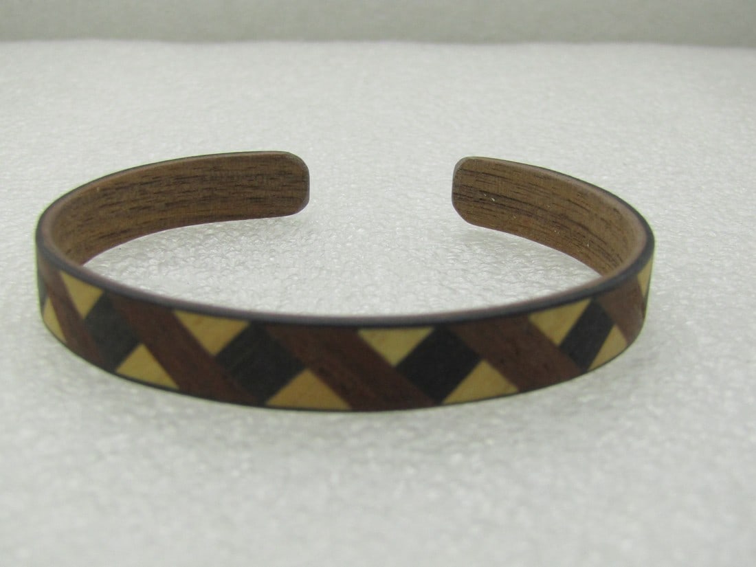 Vintage Tribal Inlaid Wooden Cuff Bracelet, 7.25", 3/8" Wide, Unisex: Vintage Tribal Inlaid Wooden Cuff Bracelet, 7.25", 3/8" Wide, Unisex, zig-zag patter in natural wood, walnut, and black with black on edges. Some flexibility to slip over the wrist. 1960's-1970's, not
