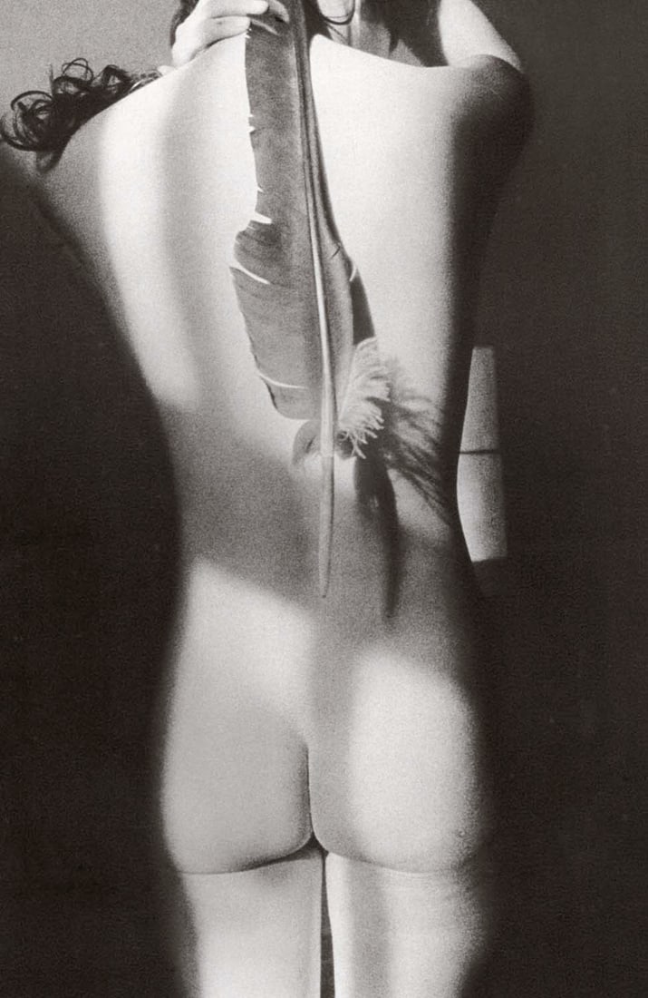 RALPH GIBSON - Untitled, Woman with Feather: Artist: RALPH GIBSON Print Title: Untitled Medium: Sheet-fed Gravure Printing date: 1980's Printed in Spain Image Size approx: 9 X 6 inches Ralph Gibson (1960-1962) was an American art photographer be