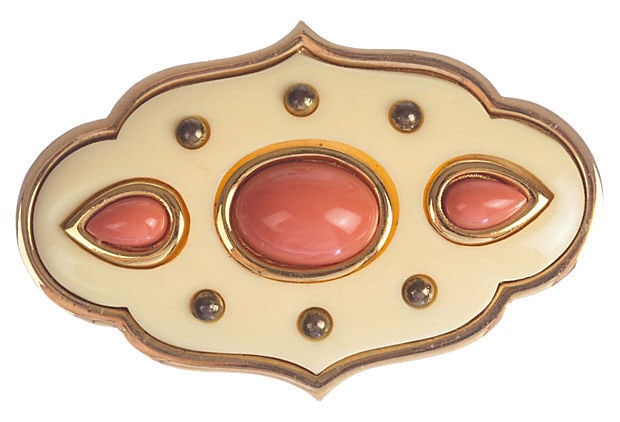 Givenchy Pink Faux-Coral Cabochon Pin: 18K gold plated pin featuring faux coral and gold cabochons. Marked: "Givenchy, Paris, New York, 1977" on the back. Dimensions: 2" L x 1" W Reserve: $196.00 Shipping: Domestic: Flat-rate of $9.30 to a