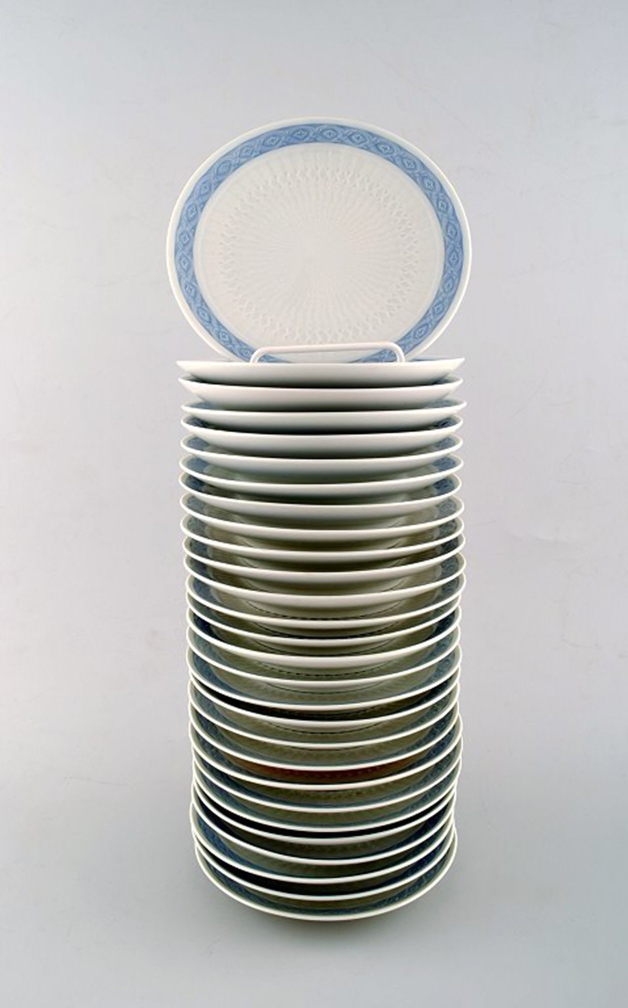 Royal Copenhagen Blue fan, bread & butter plates. 28 pcs. in stock.: 28 plates. Royal Copenhagen Blue fan, bread & butter plates. Designed by Arnold Krog in 1909. Decoration Number 1212/11533. Diameter 16 cm. In Perfect condition, 1st. factory quality. Reserve: $21.00