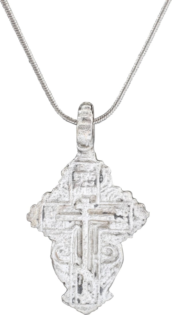 EASTERN EUROPEAN CHRISTIAN CROSS NECKLACE: 17th-18th Century, Ukrainian, Orthodox rite. Silvered bronze. Over 1 3/4” total height. Raised border delineating the cross with broad beams, the cross beam above center and enclosing a stick cr