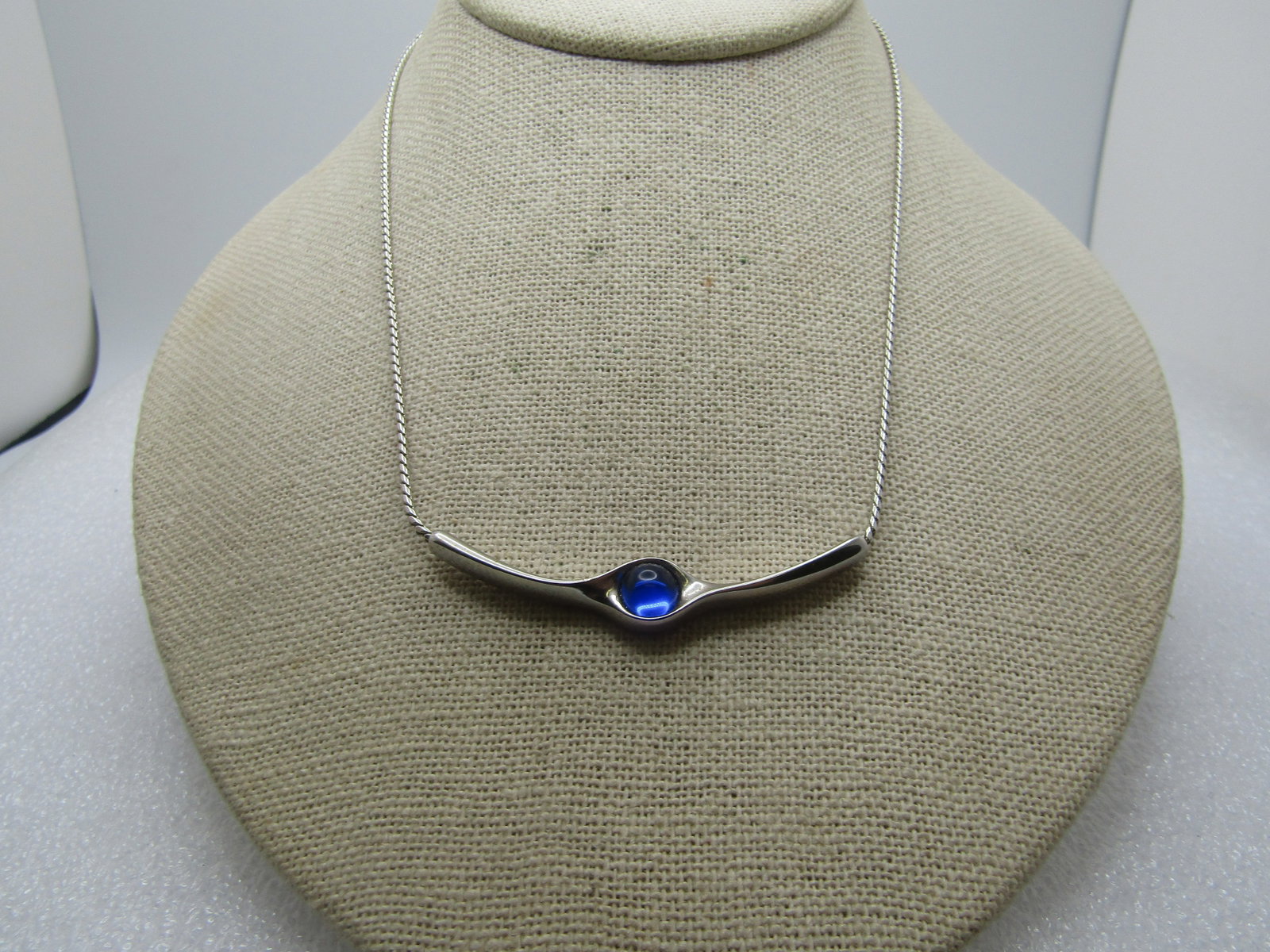 Vintage Blue Rhinestone Bar Necklace, 14"-16", Choker, Signed Sarah, 1970's: Vintage Blue Rhinestone Bar Necklace, 14"-16", Choker, Signed Sarah, 1970's. Silver tone with a roundish herringbone chain and curved bar across the front of the nect with a center round sapphire blue