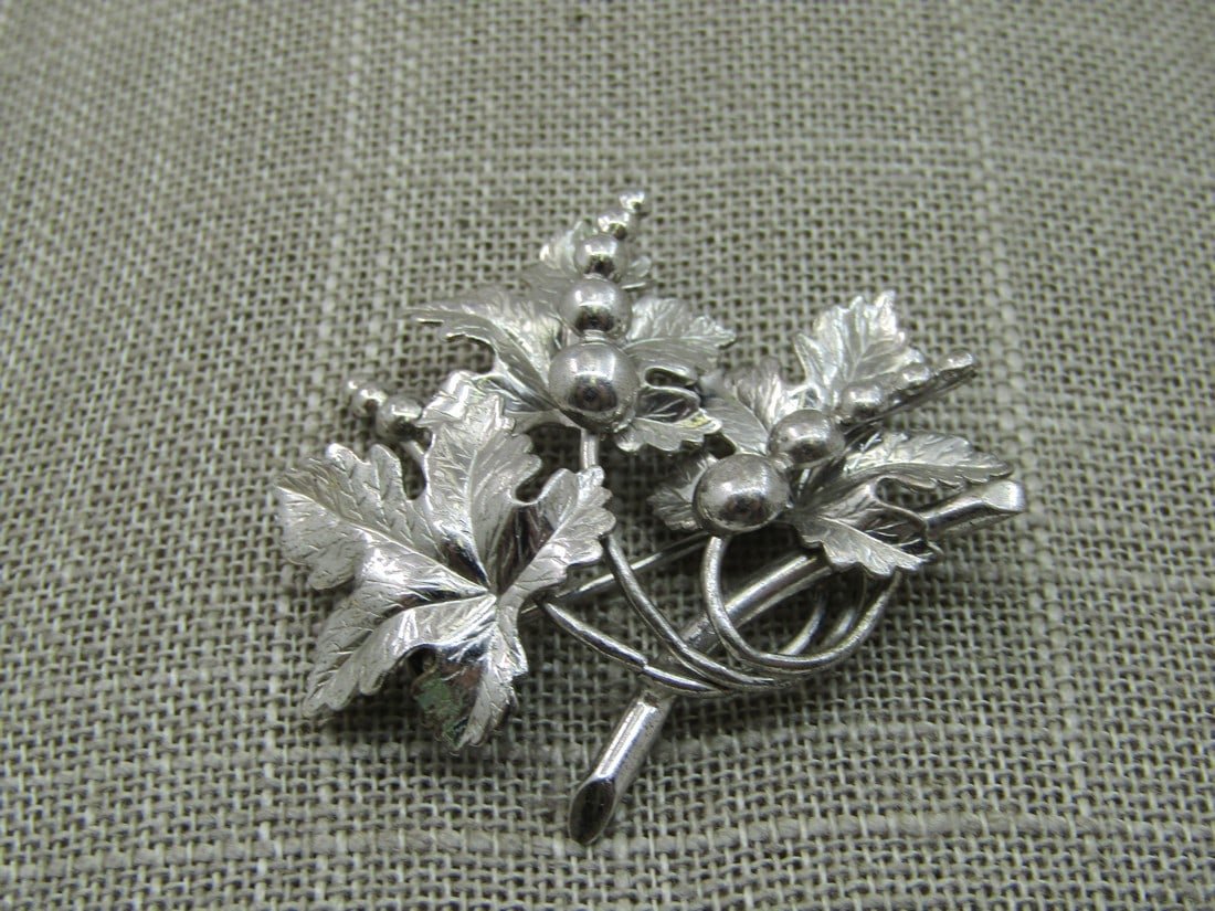 Vintage Sterling Carl Art Leaves Brooch, 1.75" by 1-5/8", 7.95 Gr, 1960's: Vintage Carl Art Sterling Leaves Brooch, 1.75" by 1-5/8", 7.95 Gr, 1960's. A cluster of maple leaves with beaded accents. Signed with maker's mark with arrow and C A on the arrow which is Carl Art. Ve