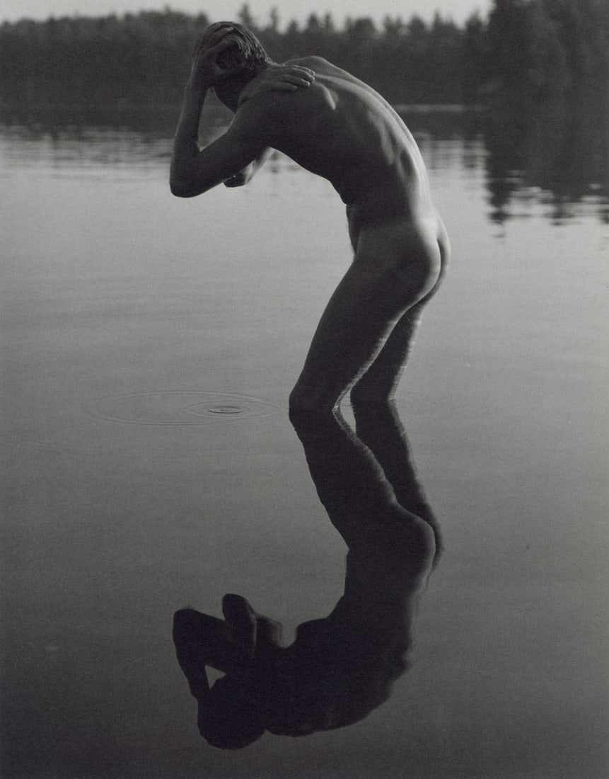BRUCE WEBER - Tyke, Lower St. Regis Lake, NY, 1988: Artist: Bruce Weber Title: Tyke, Lower St. Regis Lake, NY, 1988 Medium: Sheet Fed Gravure, 1990, USA Dimensions: 7.3x9.35" Description: Heat Wax Mounted on 11x14" Conservation Board Artist Bio: Bruce