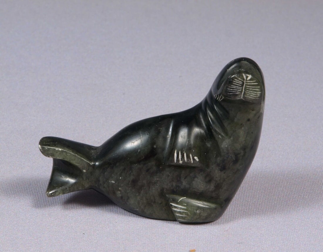 Soapstone Inuit Native Canada Figurine Black Seal Signed by Artist Vintage: This is a vintage, Native American Canadian Inuit Figurine.It is signed at the bottom. The figurine is made from black soapstone and is very beautiful.The figurine shows a seal.The carving is app. 3 1