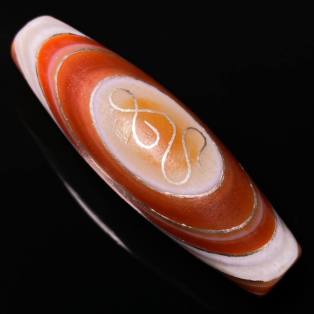 Tibetan DZI Agate Inlay Silver Wires Lucky Pendant: Title: Tibetan DZI Agate Inlay Silver Wires Lucky Pendant Date/Period: Origin: Dimension: 51x16(mm) 2.01x0.63(inches) Weight 0.04 lbs/18g Materials: DZI Agate,Silver Wires Reserve: $89.00 Shipping: Do