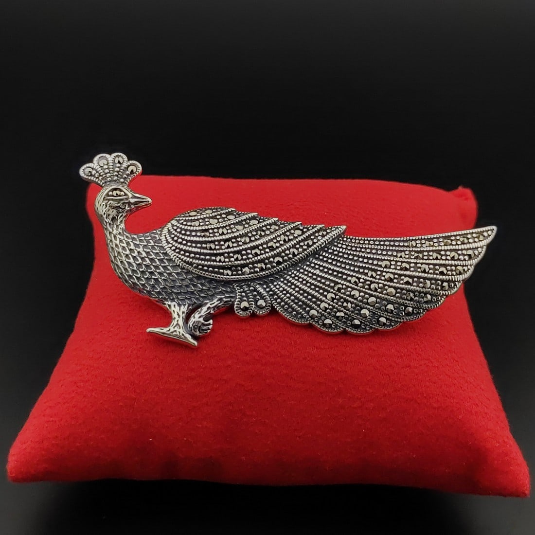 925 Silver Peacock Brooch Ornated With Marcasite: Title: 925 Silver Peacock Brooch Ornated With Marcasite Description: 925 Silver Peacock Brooch Ornated With Marcasite -Condition:New Weight:14.8g Size:1.25x3 inch (32x77mm) With Gift Box. Express Ship