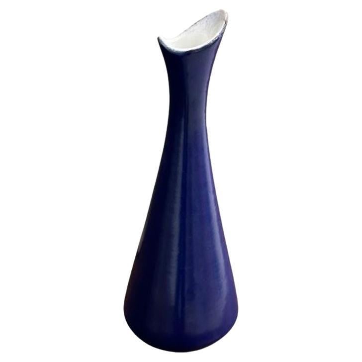 Mari Simmulson, Upsala Ekeby, Swedish Mid-Century Modern Blue Ceramic Vase, 1954: About the Item Mari Simmulson, Upsala Ekeby, Swedish Mid-Century Modern Vase, Blue Ceramic, 1954 A model 4138 vase designed by Mari Simmulson for Upsala Ekeby in Sweden, 1954. The entire vase is finis