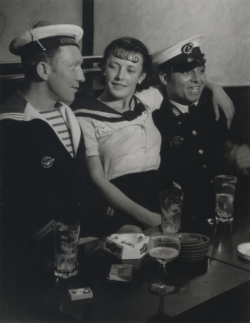 BRASSAI - Conchita With Sailors, Paris, 1933: Artist: Brassai Title: Conchita With Sailors, Paris, 1933 Medium: Photo Litho, 2008, China Dimensions: 6.5x8.4" Description: Heat Wax Mounted on 8.5x11" Conservation Board Artist Bio: Brassai was a Hu