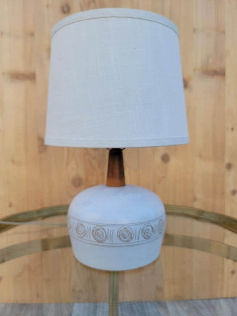 Mid Century Modern Jane & Gordon Martz Ceramic with Walnut Table Lamp with Linen Shade: Vintage from the 1950s Materials: Linen Width: 12 inches Height: 21 inches Depth: 12 inches Mid Century Modern Jane & Gordon Martz Ceramic with Walnut Table Lamp with Linen Shade Gorgeous Mid Century