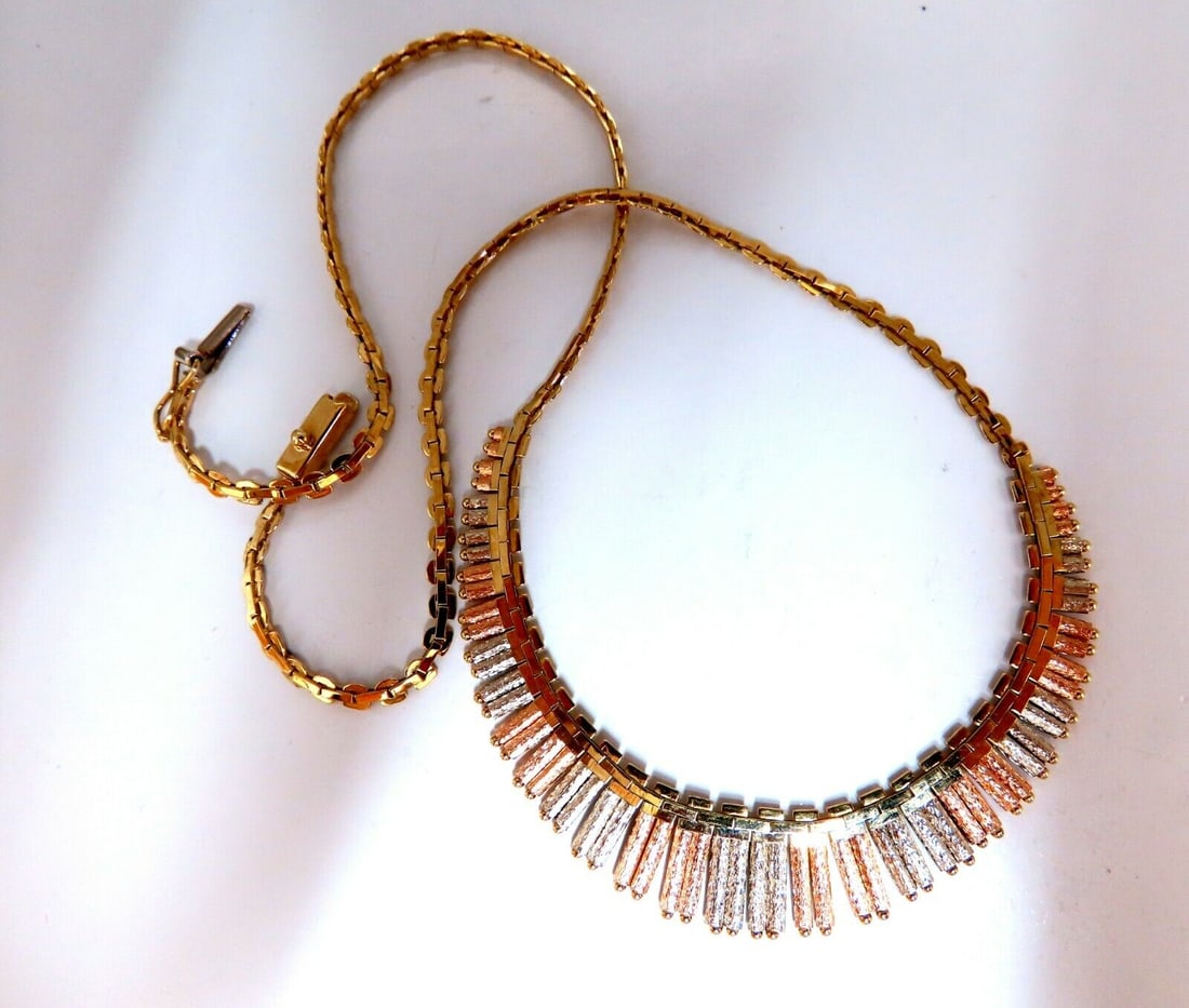 Inspiring Instrumental Portative Organ Graduating Tubular Linked Necklace 14kt: Graduating Musical Instrumental Portative Organ Necklace Necklace: 17 Inches (wearable length) Each Section Caliber 3mm Wide Center Tubes: 5-12mm 14kt. yellow gold 17.6 Grams. Comfortable Slip Clasp L