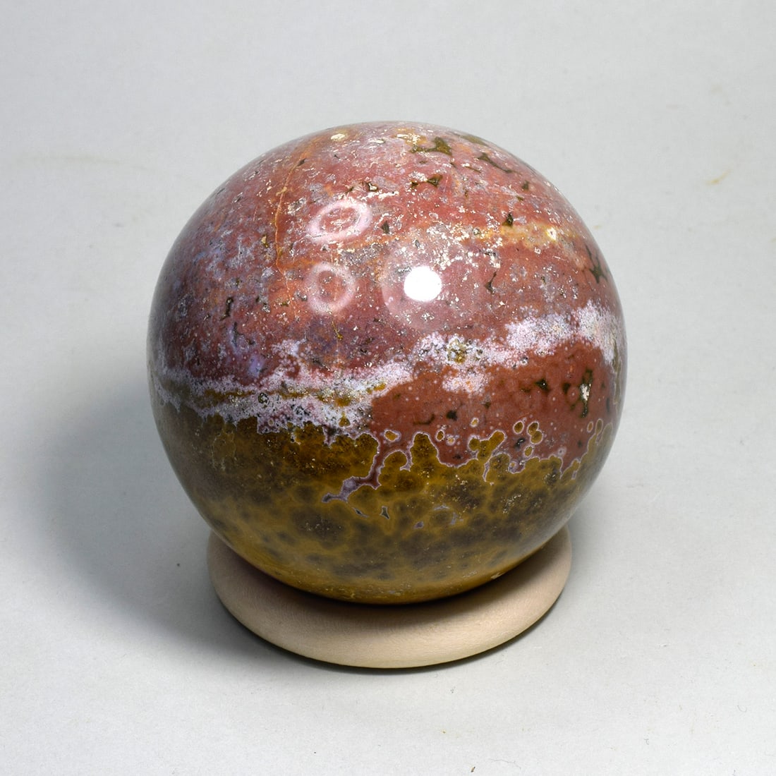 Fine 7.2 cm Polished Ocean Jasper sphere: Title: Fine 7.2 cm Polished Ocean Jasper sphere Origin: Madagascar Size: 7.2 cm diameter Description: Species: Jasper (Ocean Jasper) Locality: Madagascar Diameter: 7.2 cm Weight: 0.5 kg Fine polished