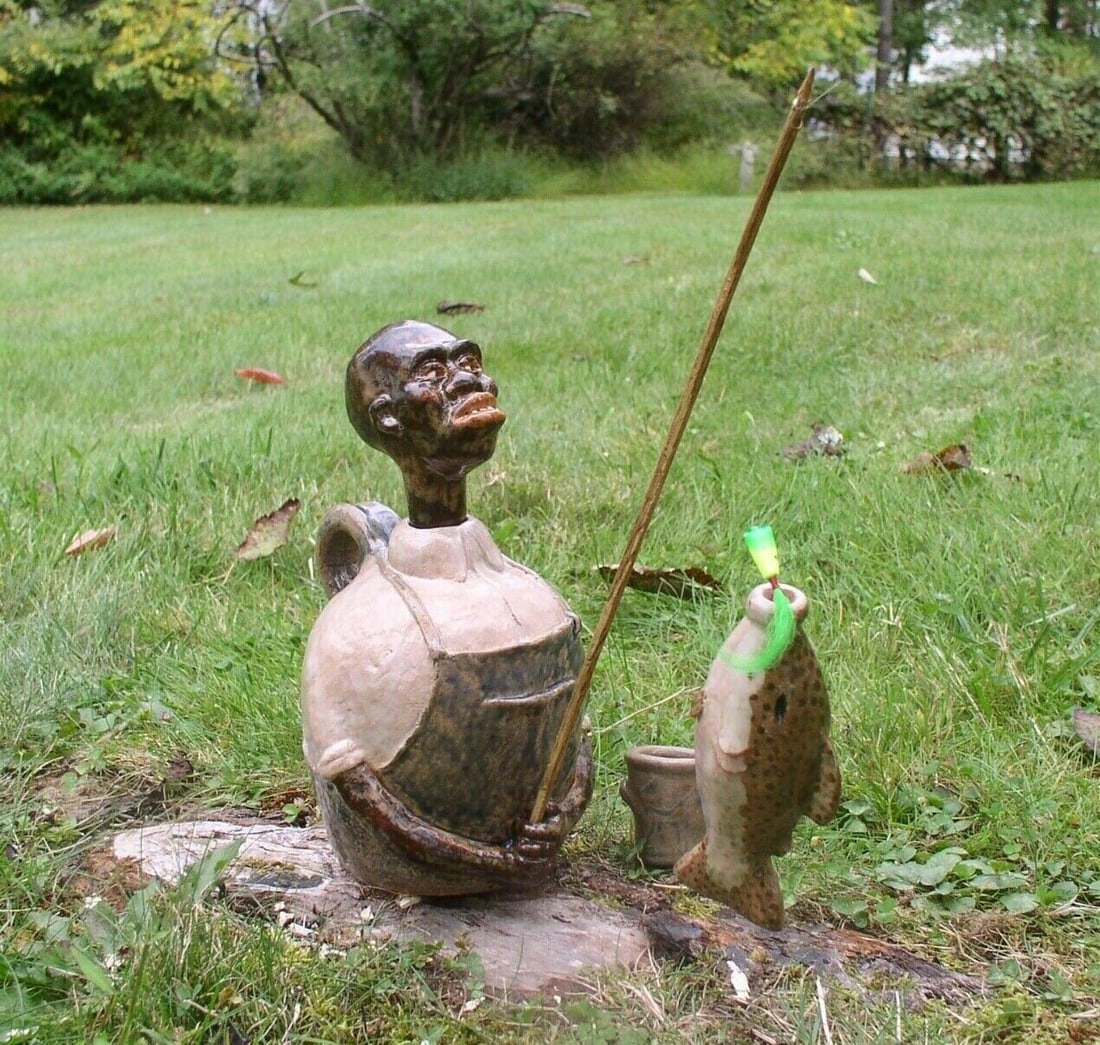 Fisherman Face Jug Landing a Fish with a Pocket Flask. One of a Kind by Ed Berdej: Title: Fisherman Face Jug Landing a Fish with a Pocket Flask. One of a Kind by Ed Berdej Description: One of a KIND High Fired Stoneware Folk Art by Berdej. Fisherman Face Jug Landing a Fish Face Jug 