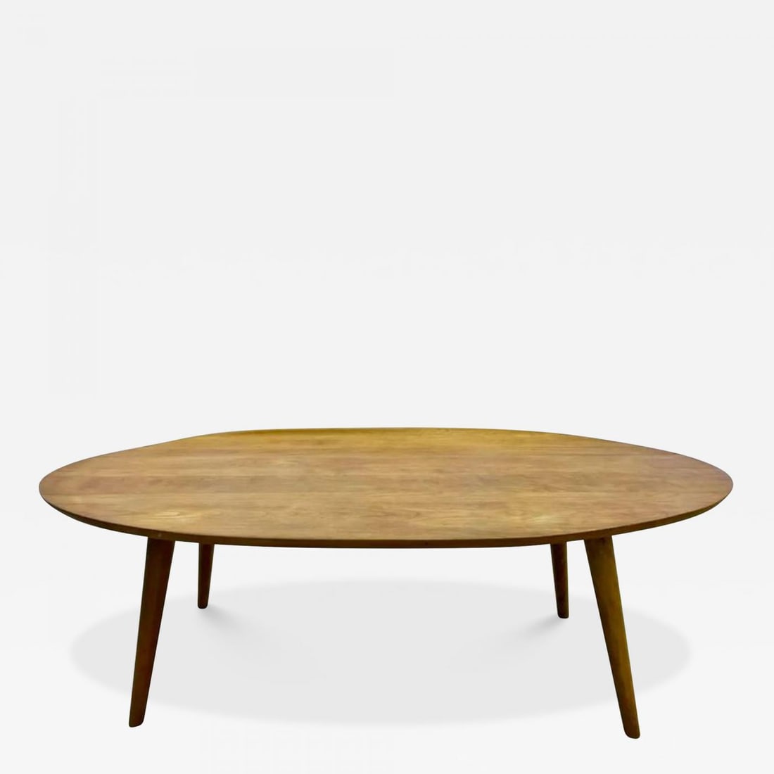 Mid-Century Modern Conant Ball Coffee Table Designed by Russel Wright: Mid-Century Modern Conant ball coffee table designed by Russel Wright. The Elliptical Coffee Table With Curled Edge is a sleek and stylish example of this designers work in a grained maple. USA, c. 19