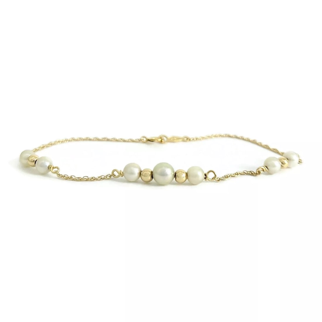 Pearl Gold Bead Station Chain Bracelet 14K Yellow Gold, 1.49 Grams: Pearl Gold Bead Station Chain Bracelet 14K Yellow Gold, 1.49 Grams This is a lovely bracelet. Please let us know if you have any questions. Pearls: 7 round cultured pearls; 4.1 mm and 4.9 mm Metal: 14