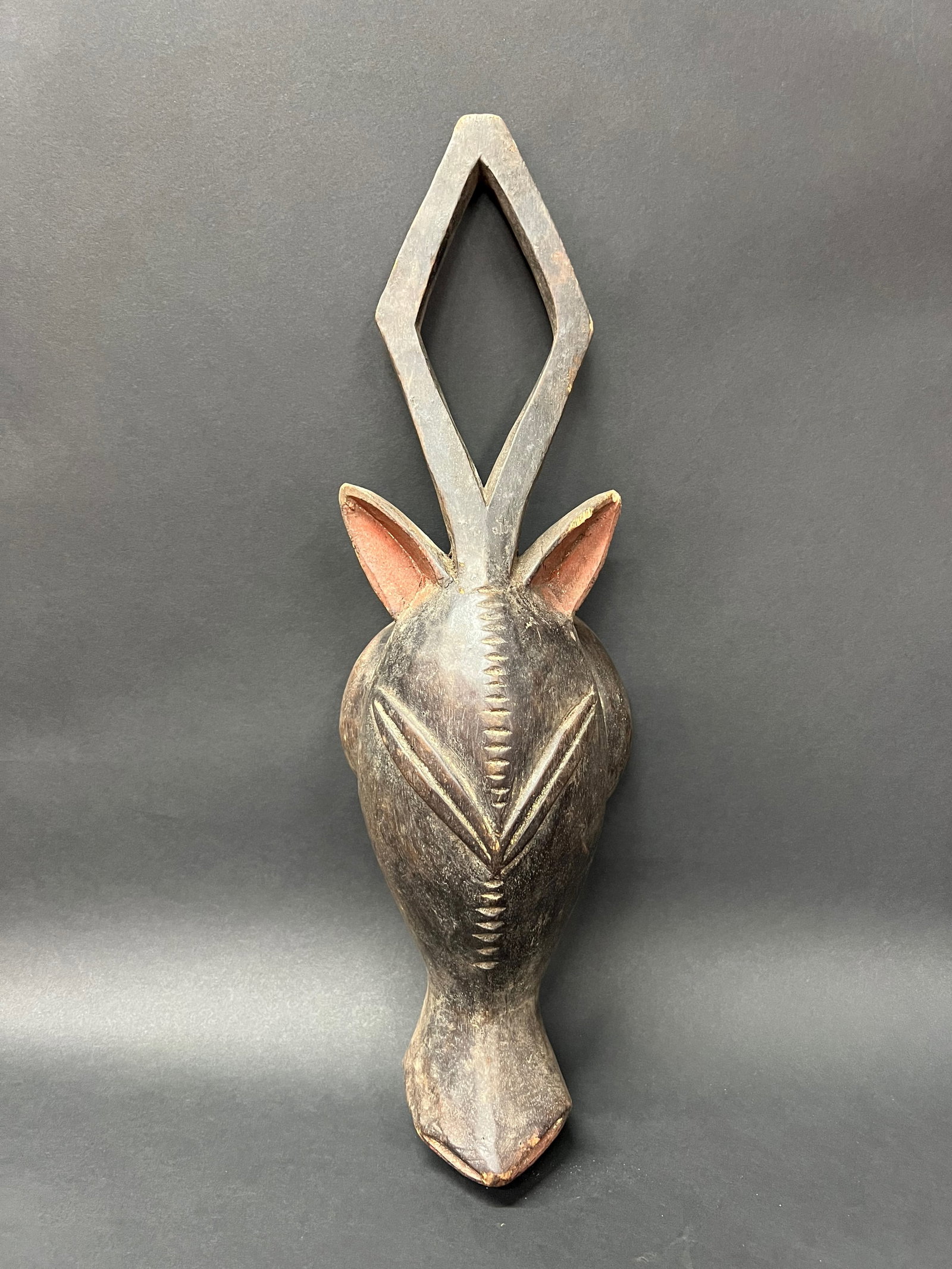 Baule Mask: Title: Baule Mask Date/Period: Late 20th Century Material: Wood Dimension: 18" h x 5.75" w Description: African Tribal Art Baule Mask from Ivory Coast Reserve: $70.00 Shipping: Domestic: Flat-rate of 