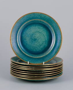 Josef Ekberg for Gustavsberg, Sweden. A set of ten ceramic plates with glaze in blue-green tones and: Josef Ekberg for Gustavsberg, Sweden. A set of ten ceramic plates with glaze in blue-green tones and a gold rim. Mid-20th century. Marked. In perfect condition. Dimensions: Diameter 18.5 cm. Reserve: