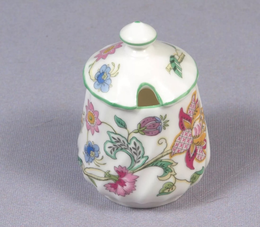 Minton Haddon Hall Mustard Pot Green England: This is a gorgeous Bone China Mustard pot from the Haddon Hall pattern by Minton - Made in England. The pieces are properly marked. It is decorated with pastel flowers on a white background and has a 