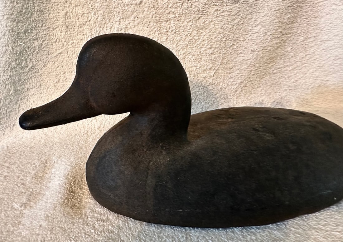 Iron Sink Box Duck Decoy c.1900: A cast iron Sink Box Duck Decoy dating to the very early 20th century, or a bit older. These iron decoys were used as ballast on sink boxes or punt boats that were used for hunting waterfowl. These re