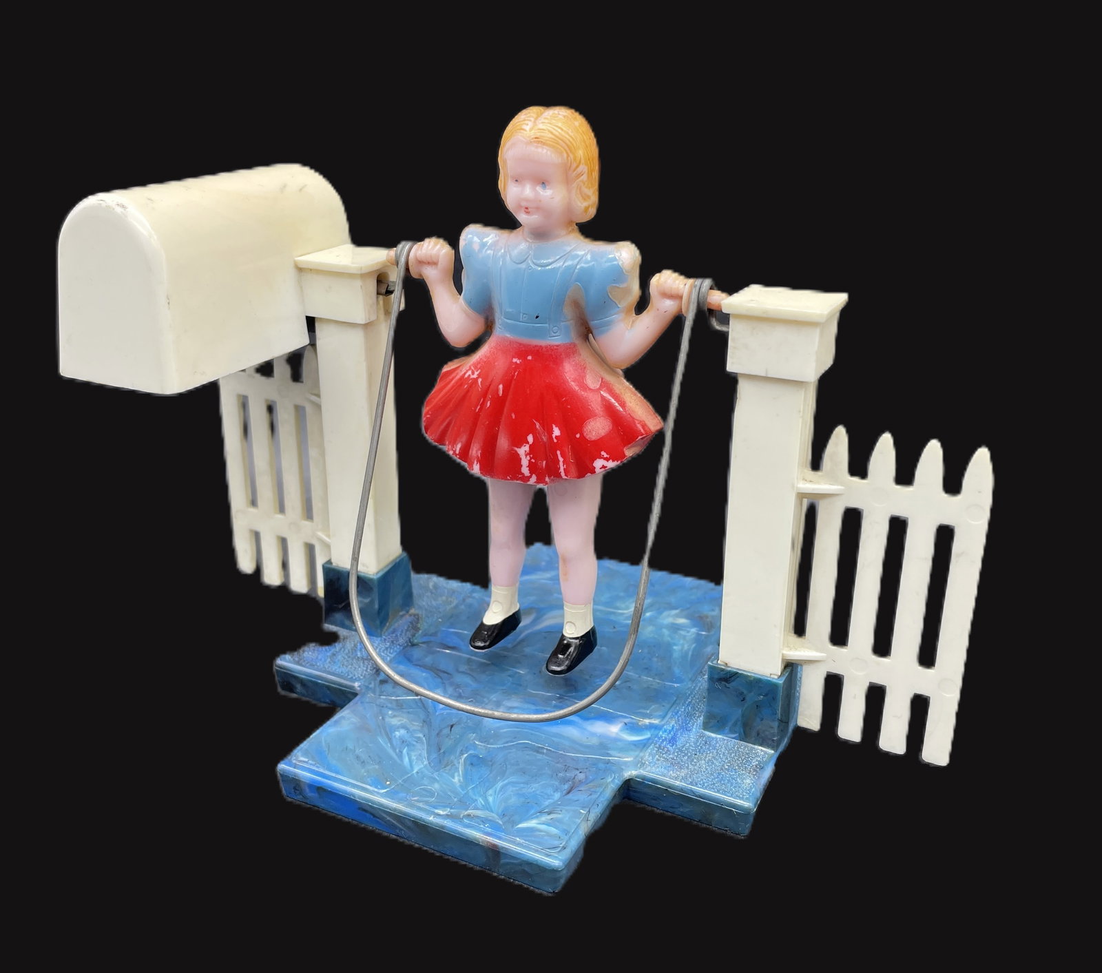 VINTAGE 1950'S HARD PLASTIC GIRL JUMPING ROPE WIND-UP by Plasco: Title: VINTAGE 1950'S HARD PLASTIC GIRL JUMPING ROPE WIND-UP by Plasco Date/Period: approx 1950's Dimension: 7" x 5" x 4.5" Material: plastic Additional Information: VINTAGE 1950'S HARD PLASTIC GIRL J