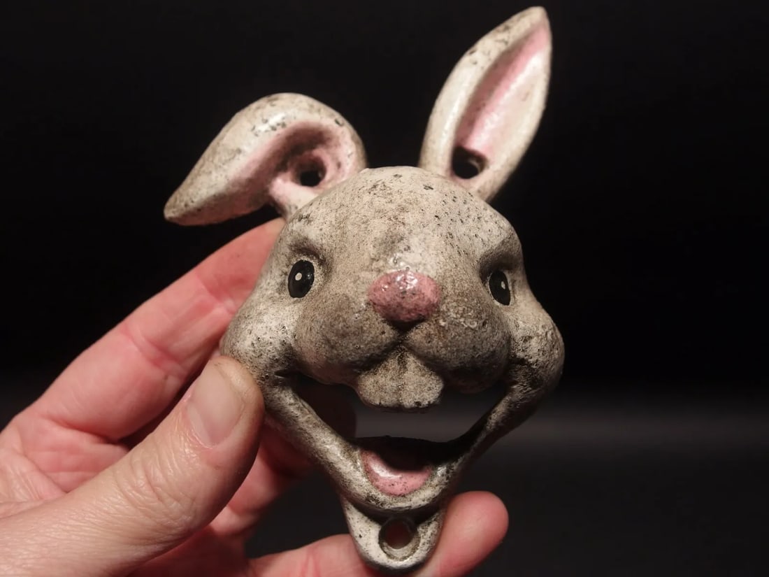 Cast Iron folk art Rabbit Wall mount Bottle Opener: 5 3/4" Tall x 4" Wide Great reproduction cast iron bottle opener. This piece was made to look just like an antique, but is new. Reserve: $15.00 Shipping: Domestic: Flat-rate of $6.00 to anywhere withi