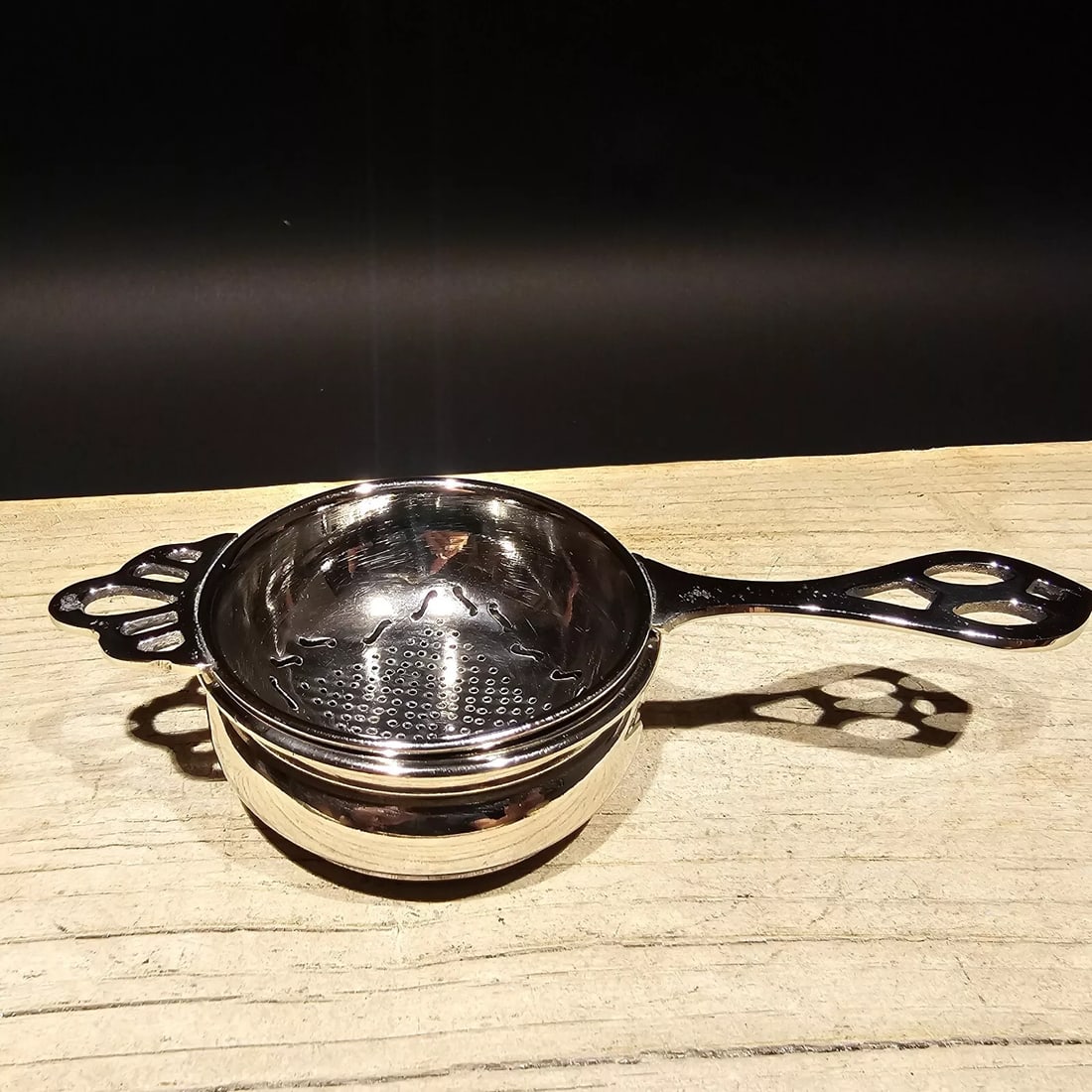 Nickel Plated Tea Strainer with Catch Bowl: Strainer: 6-5/8" long, 2-3/4" diameter, 1" tall – Catch bowl: 2-7/8" diameter, 1-1/2" tall – Antique vintage look – Hand washing recommended Strain your tea in style using our elegan